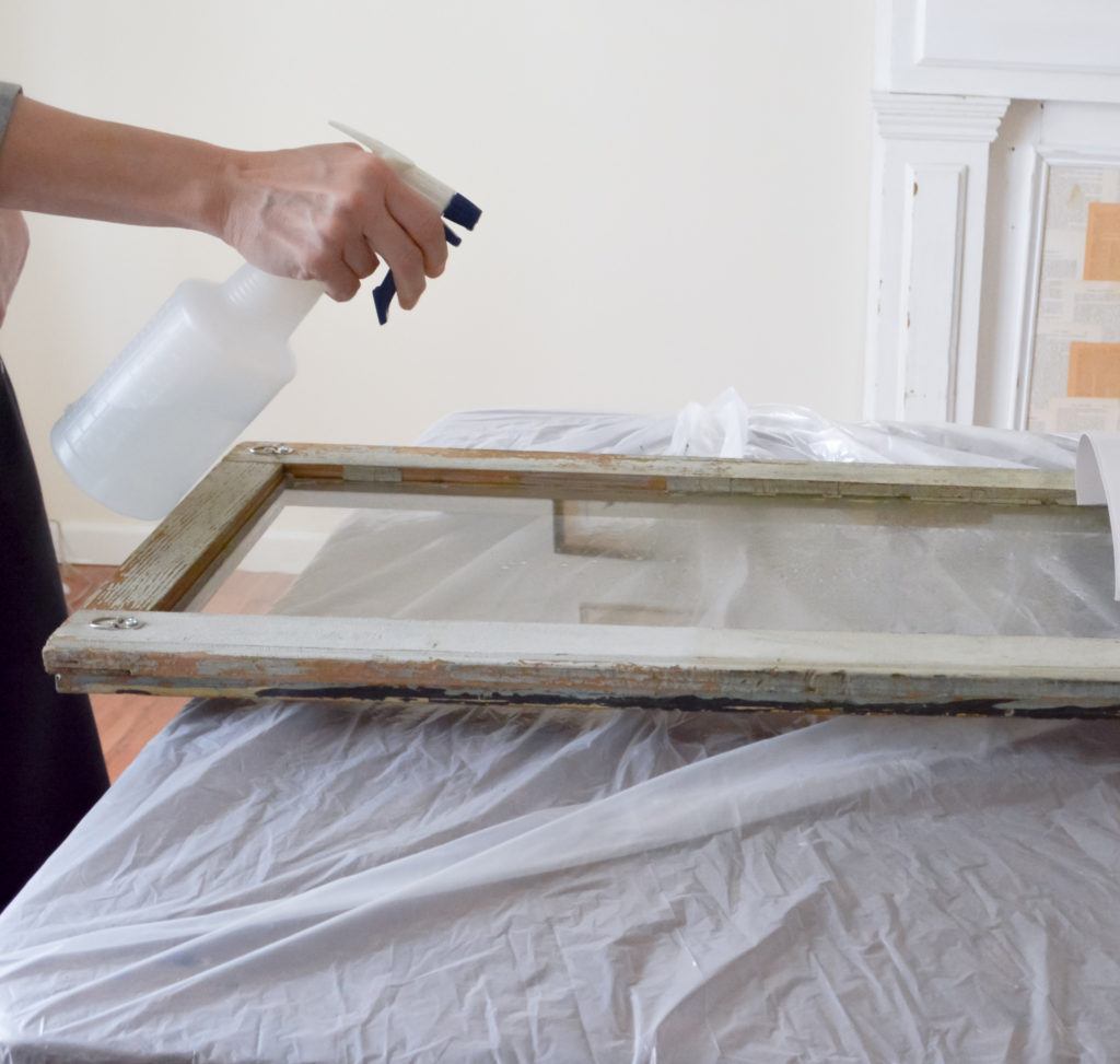 applying privacy film to antique window