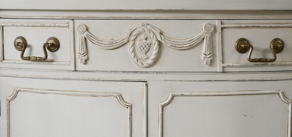 painted details of antique buffet