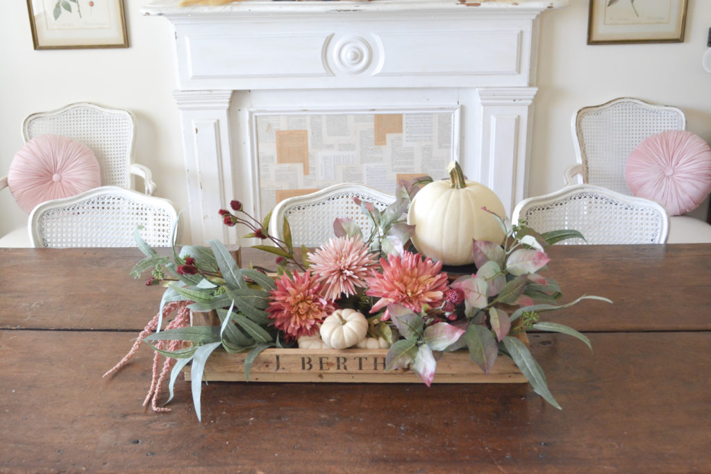 A DIY french fruit crate filled with fall decor