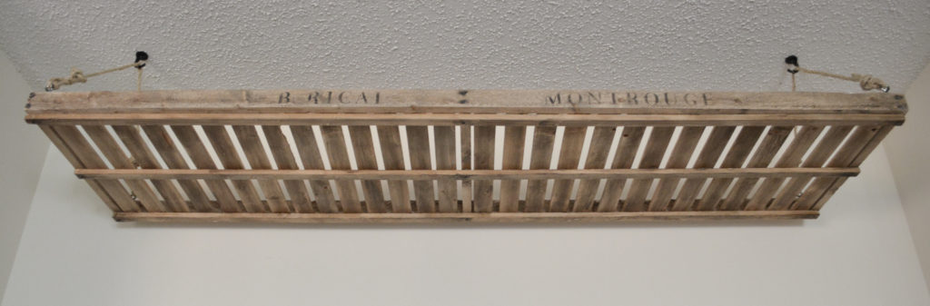 a french drying rack hanging from the ceiling