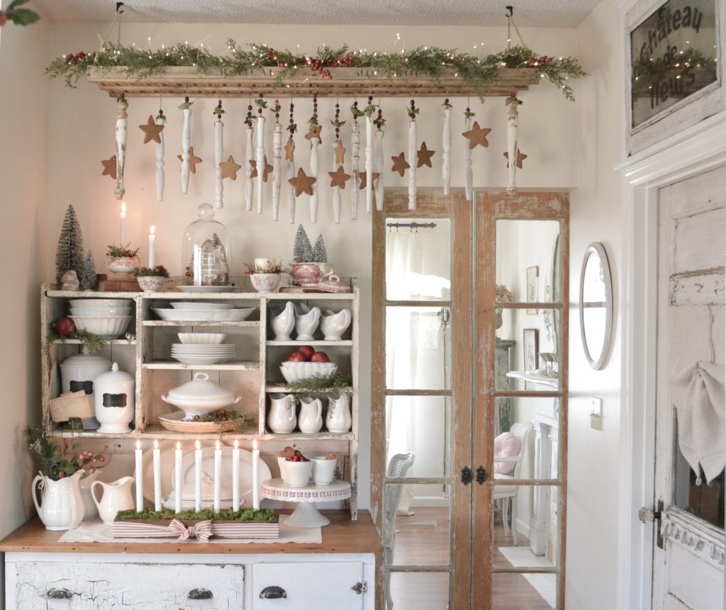 french farmhouse Christmas kitchen with antique drying rack and spindle ornaments