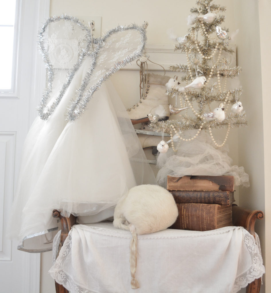 Angel costume, vintage skates, and tinsel tree