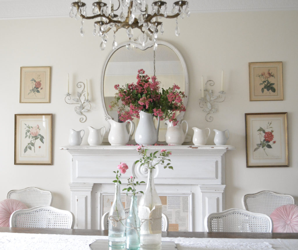 Vintage floral rose prints over antique fireplace mantle