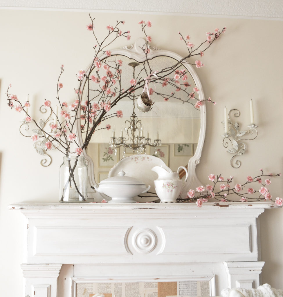 Spring flowering branch on antique fireplace mantel