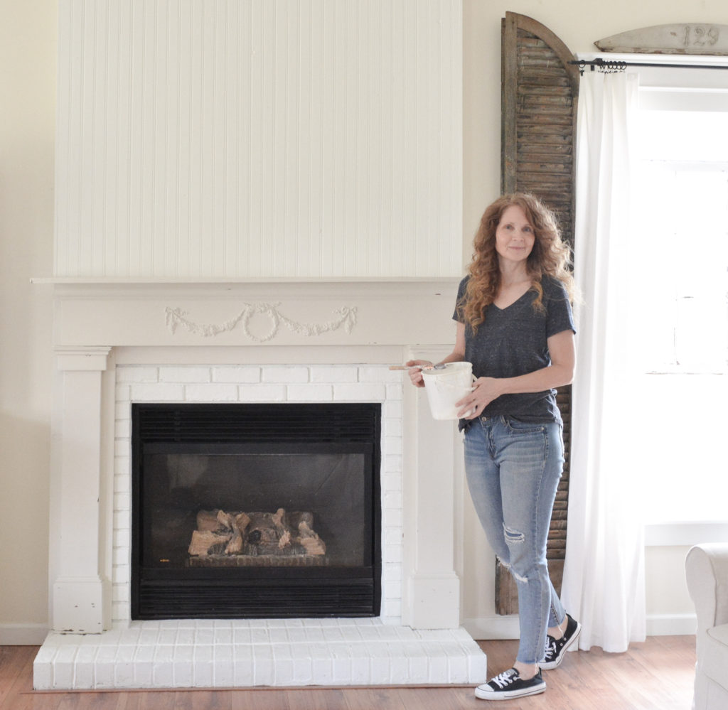 A DIY fireplace makeover with paint and beadboard