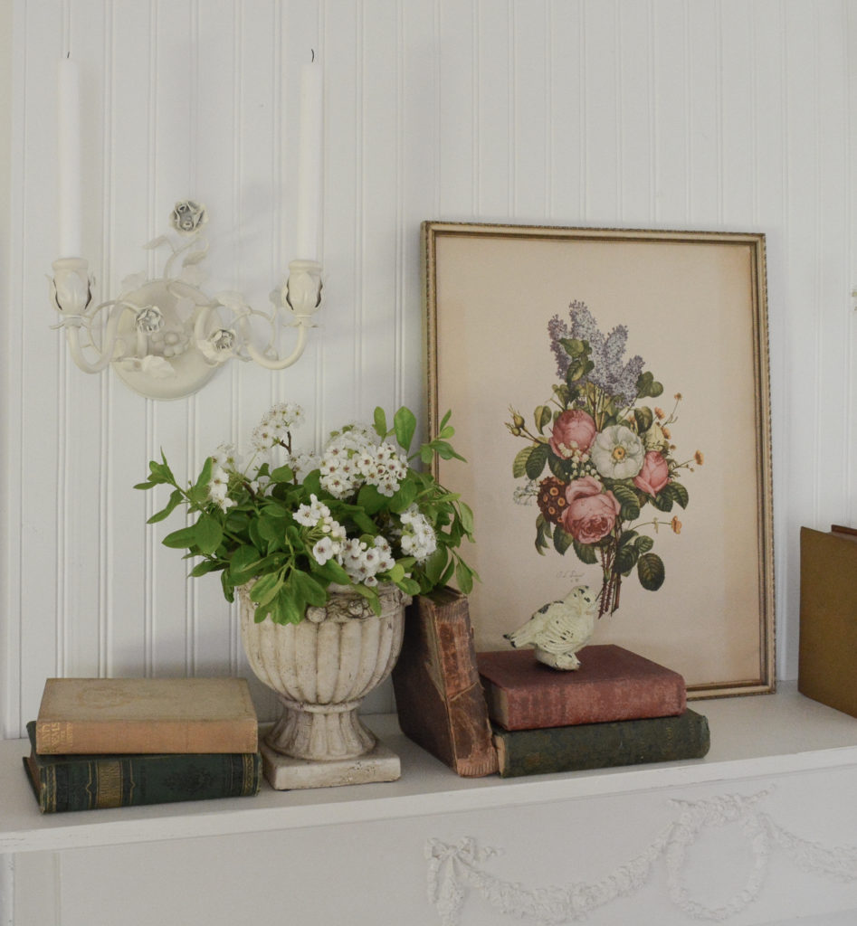 pear tree blossoms, old books. and a vintage floral print