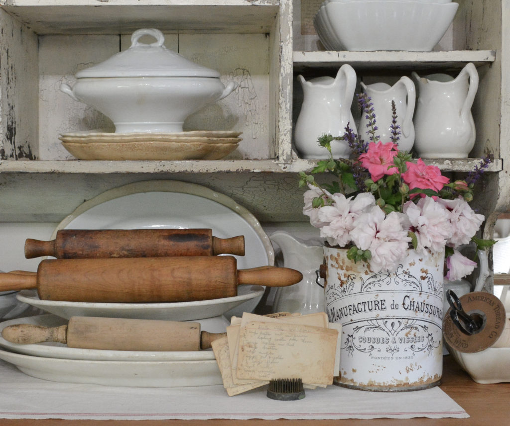 DIY vintage french tin in chippy white cabinet with ironstone dishes