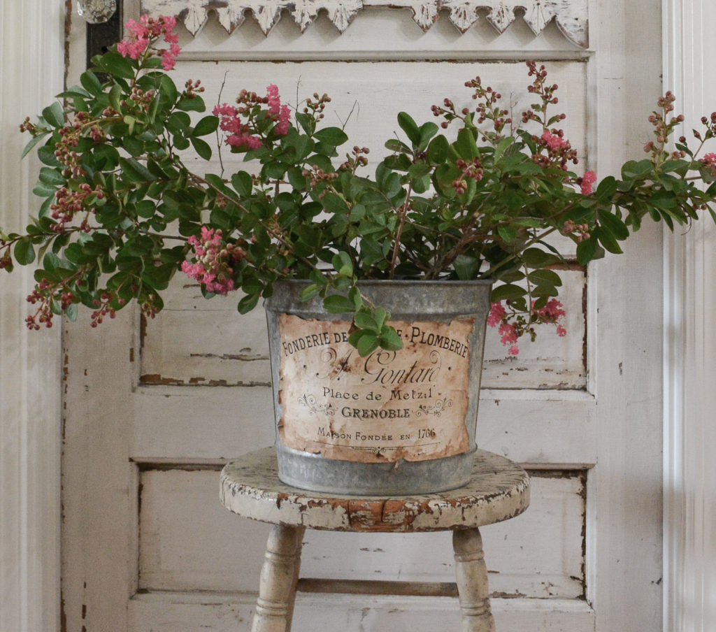 vintage bucket with branches