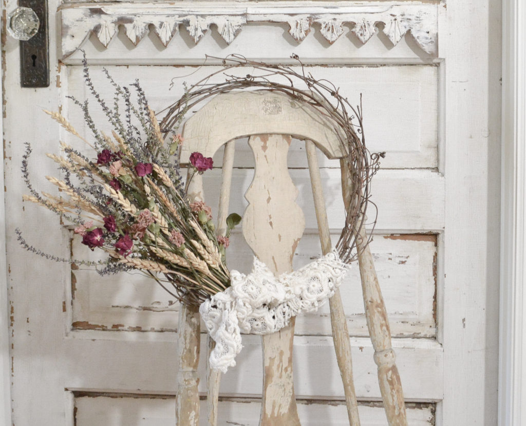 Chippy paint chair diplaying a DIY dried flower wreath