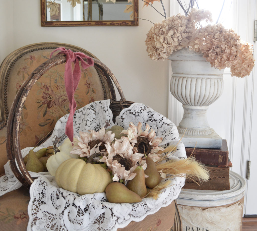 vintage french chair with basket of pumpkins