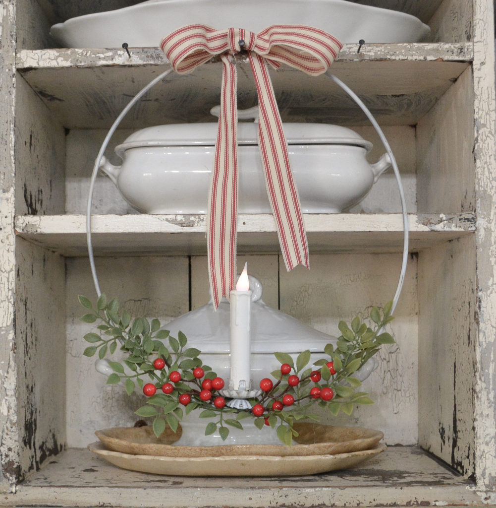 A Diy hanging candle ring with ticking ribbon