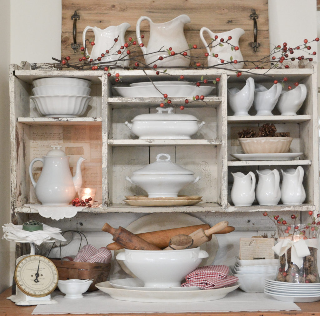 DIY realistic berry branches on chippy hutch filled with ironstone