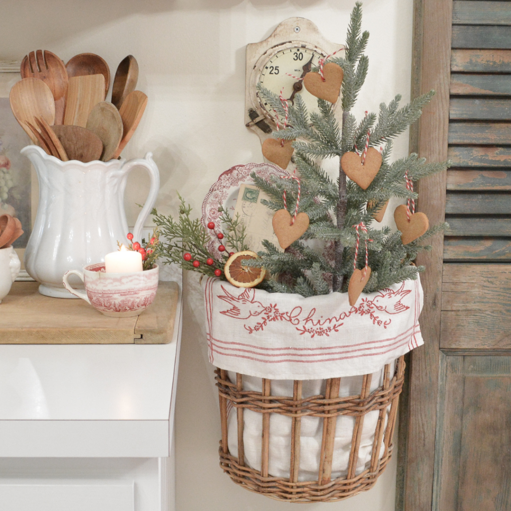 hanging basket with small Christmas tree and gingerbread ornaments