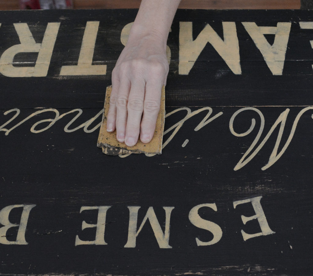 distressing a stenciled sign