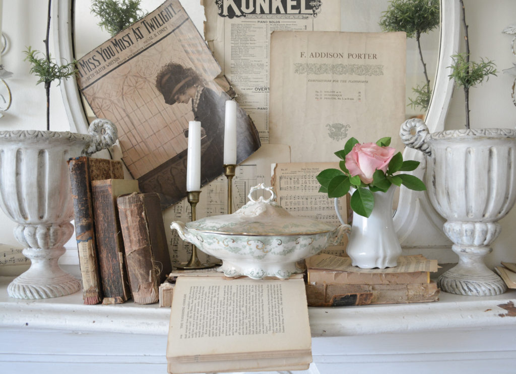 mantel decorated in sheet music, old books, 