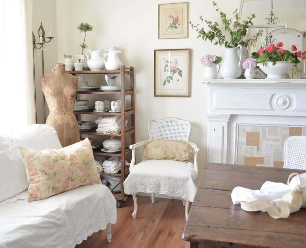 furniture draped in white linens for a summer white cottage look