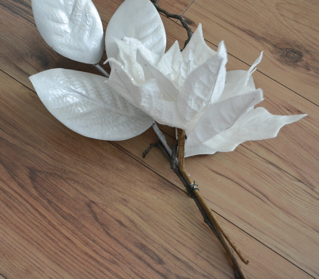 Floral pick wired to tree branch to create  Christmas mantel decor