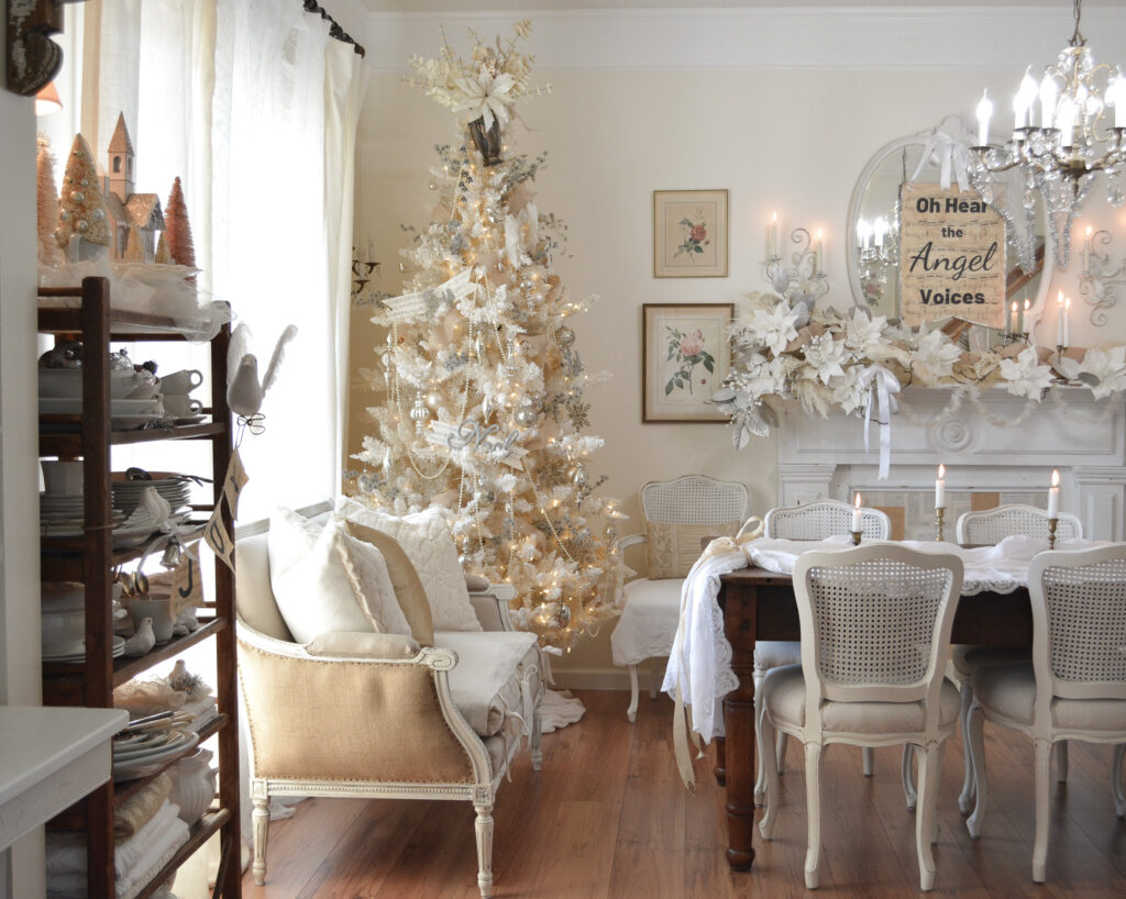 a white dining room decorated for Christmas
