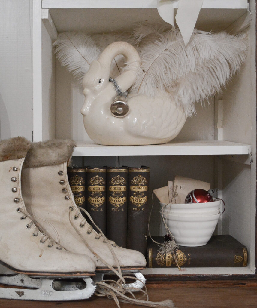 vintage skates and swan planter decorated for Christmas