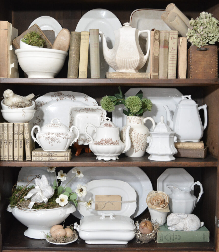 an antique cupboard decorated for spring